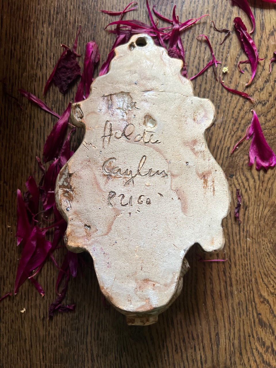 fa535 ceramic plaque/font with signature on back