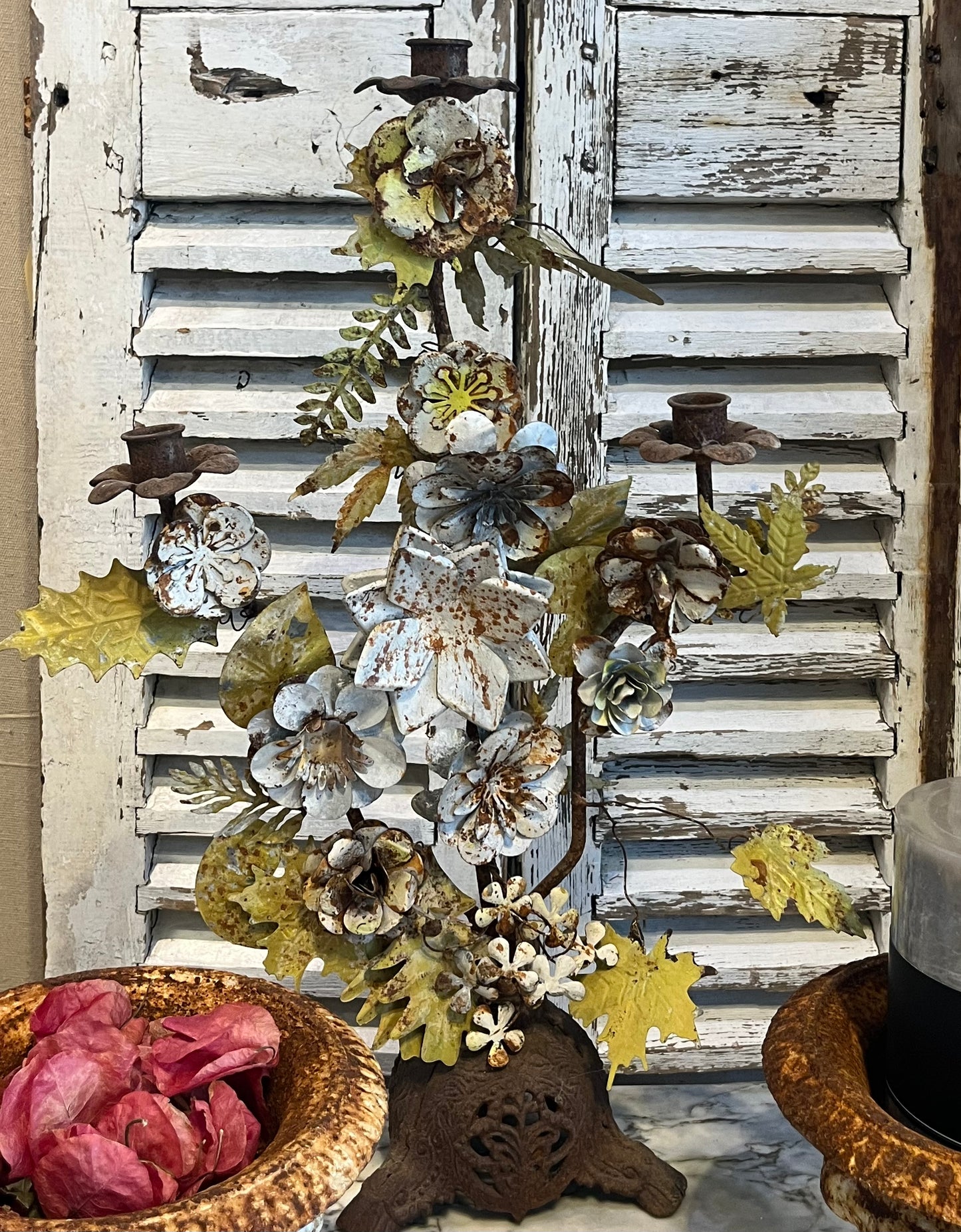 Metal candelabra with handmade metal flowers and leaves