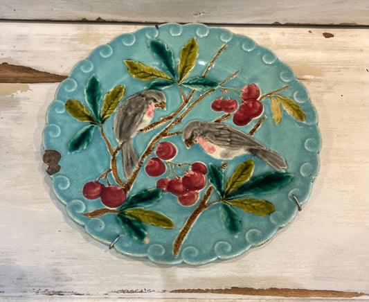 French antique majolica plate adorned with birds and cheeries