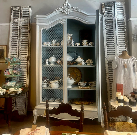 a tall pair of French antique shutters