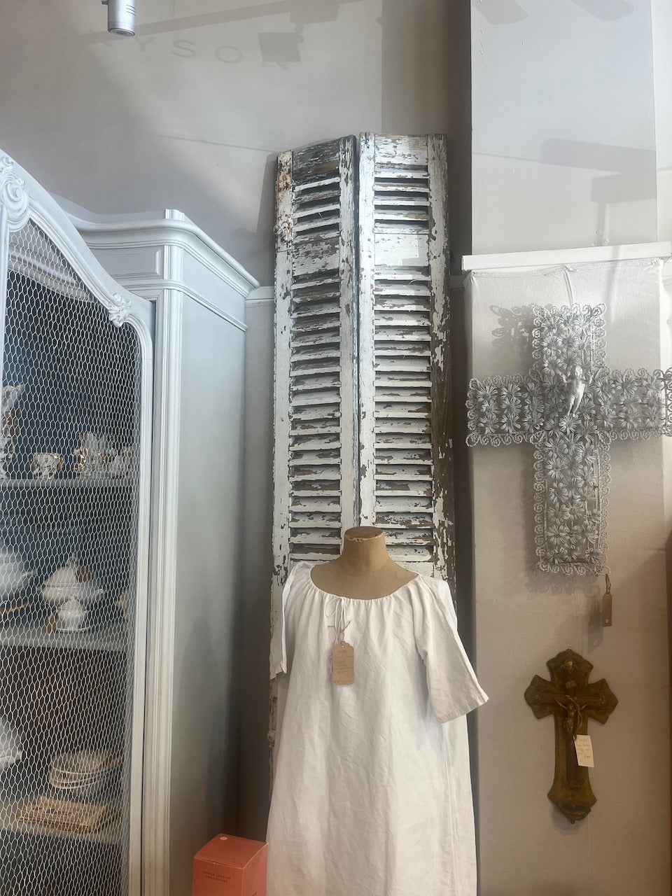 a tall pair of French antique shutters
