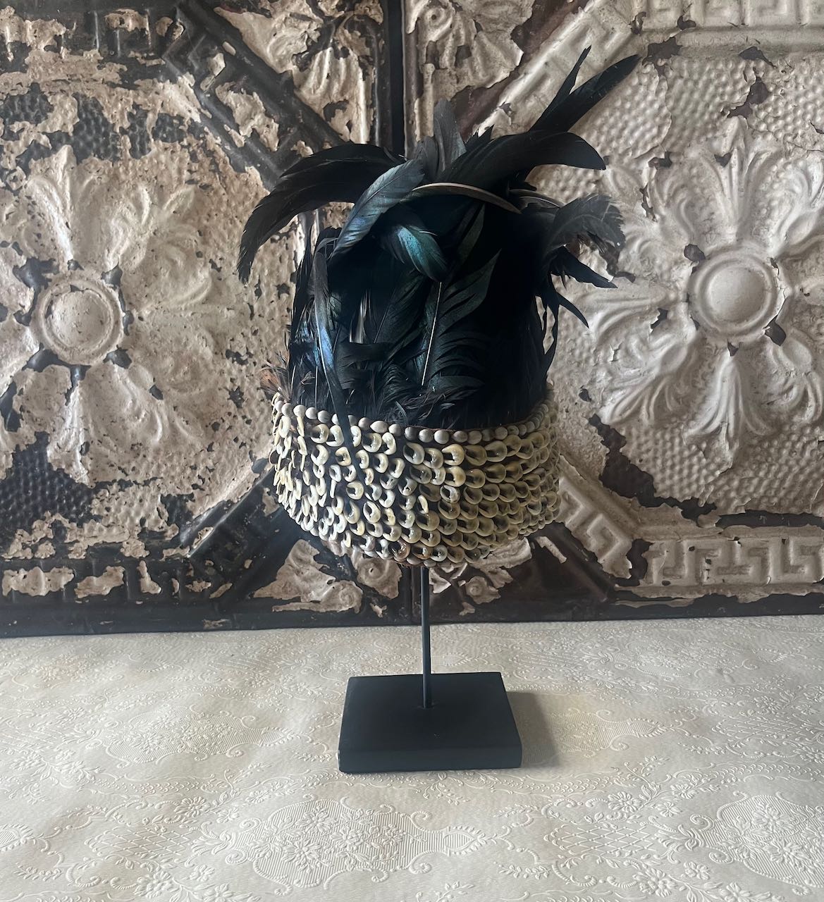  tribal feather and shell headdress, often referred to as a Papua Feather Crown.