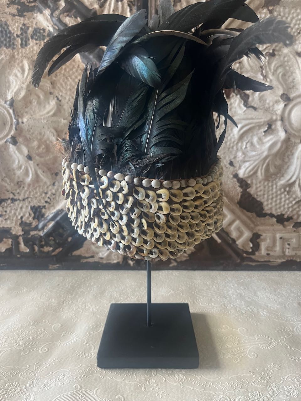  tribal feather and shell headdress, often referred to as a Papua Feather Crown.