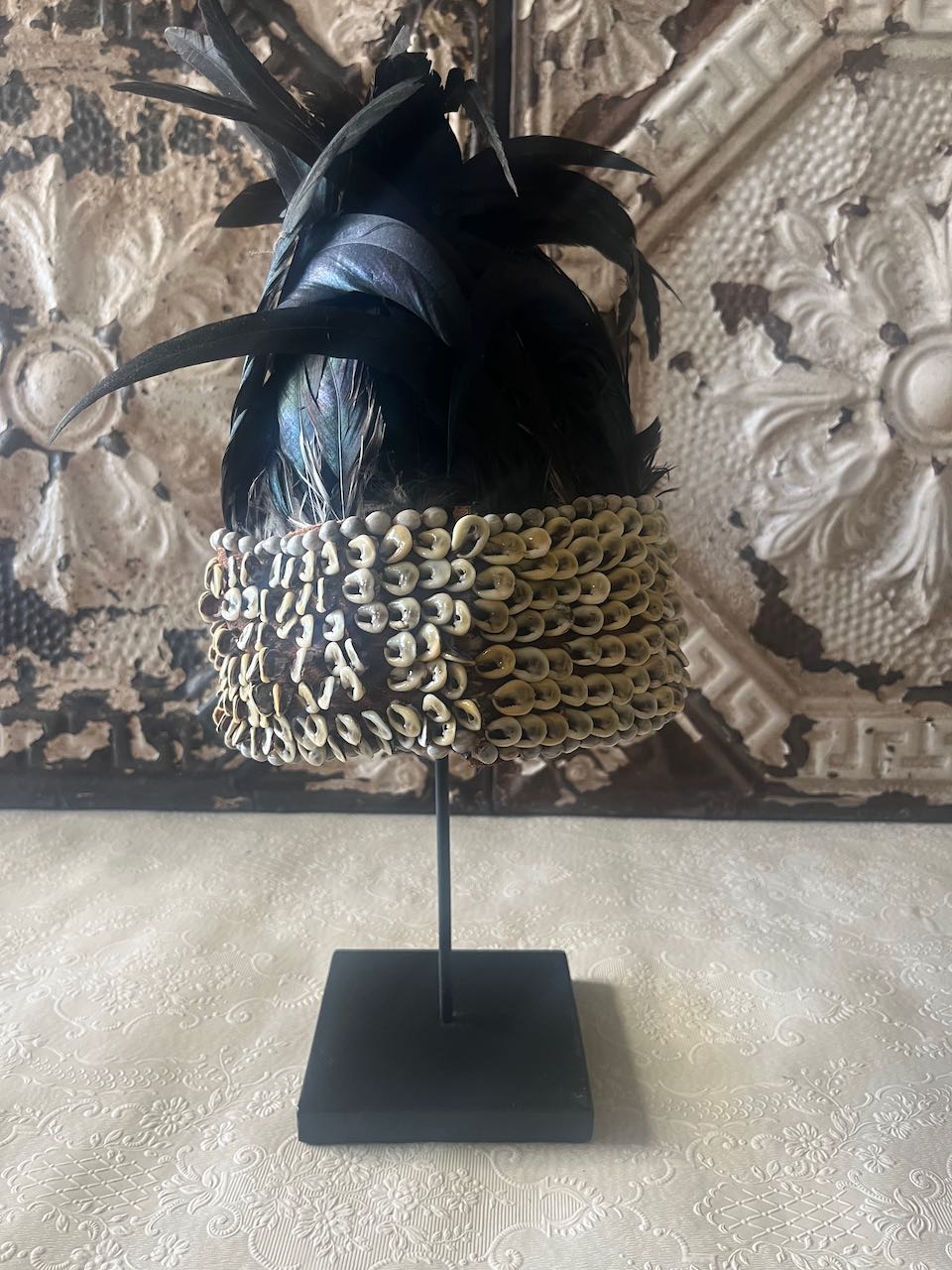 tribal feather and shell headdress, often referred to as a Papua Feather Crown.