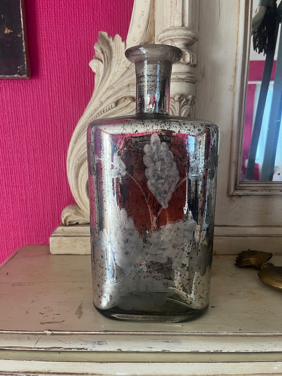 Vintage silver mercury glass bottle with etched floral pattern, 