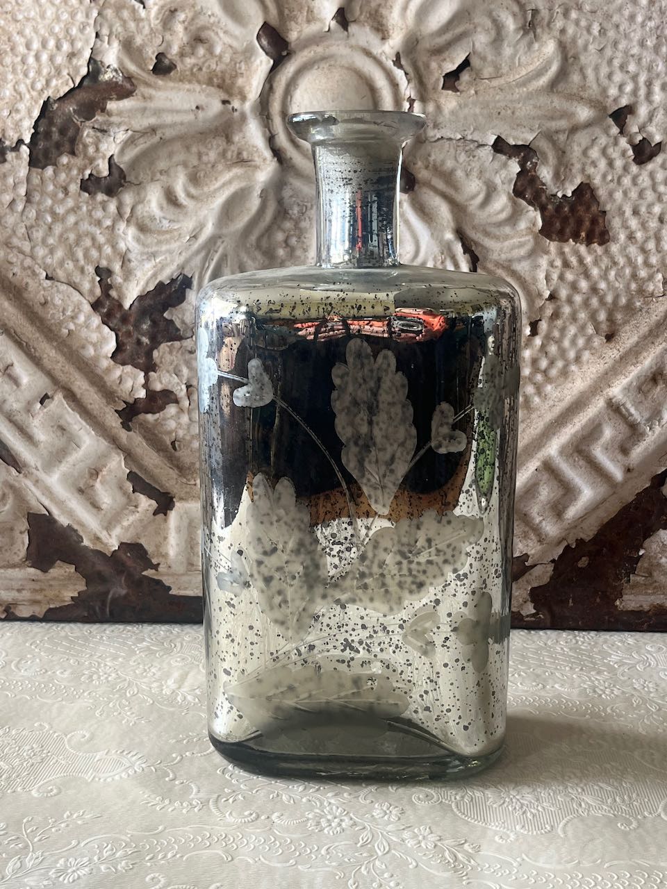 Vintage silver mercury glass bottle with etched floral pattern, f