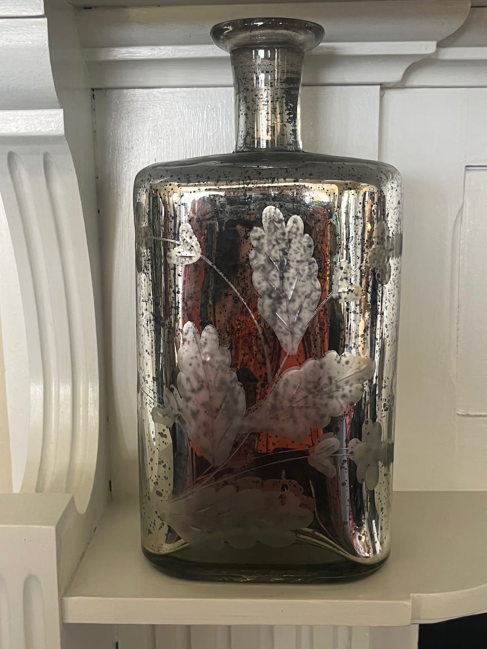 Vintage silver mercury glass bottle with etched floral pattern, 