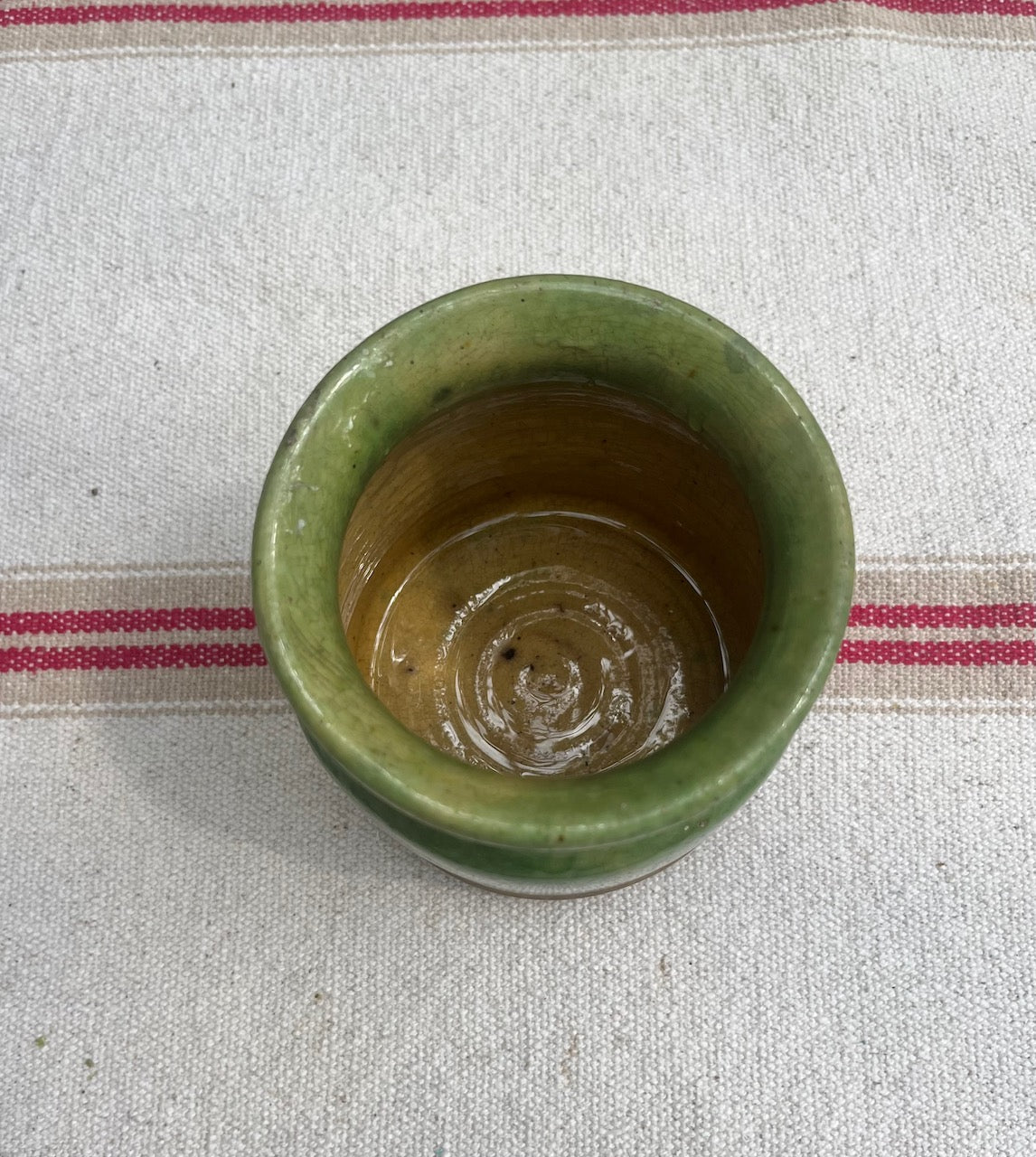 fa558 Small Provencial green pottery jar with mustard glaze inside