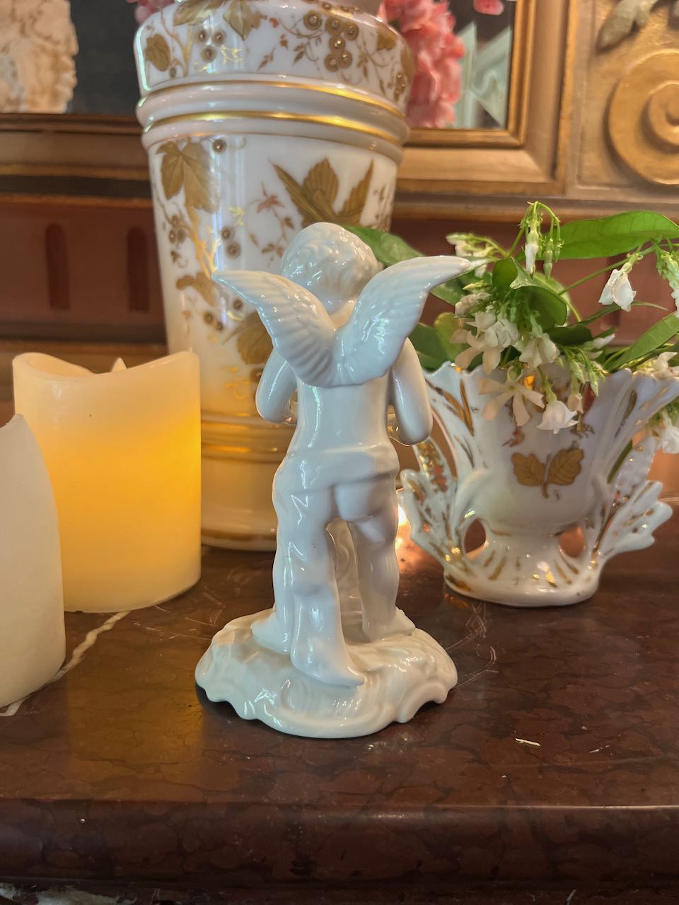 fa622 Small porcelain Dresden Cherub by the fire