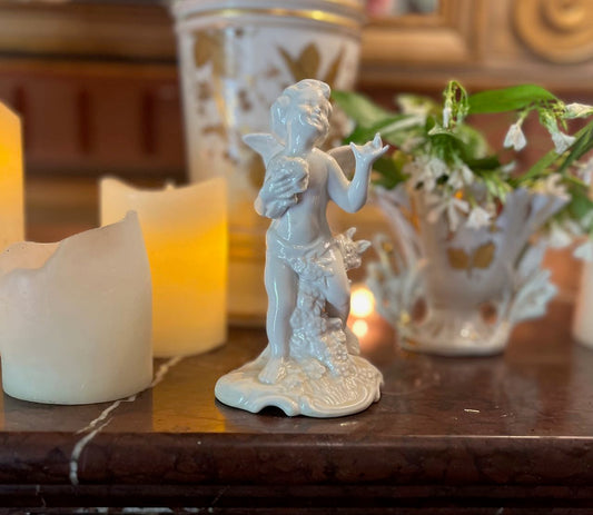 fa622 Small porcelain Dresden Cherub with flowers